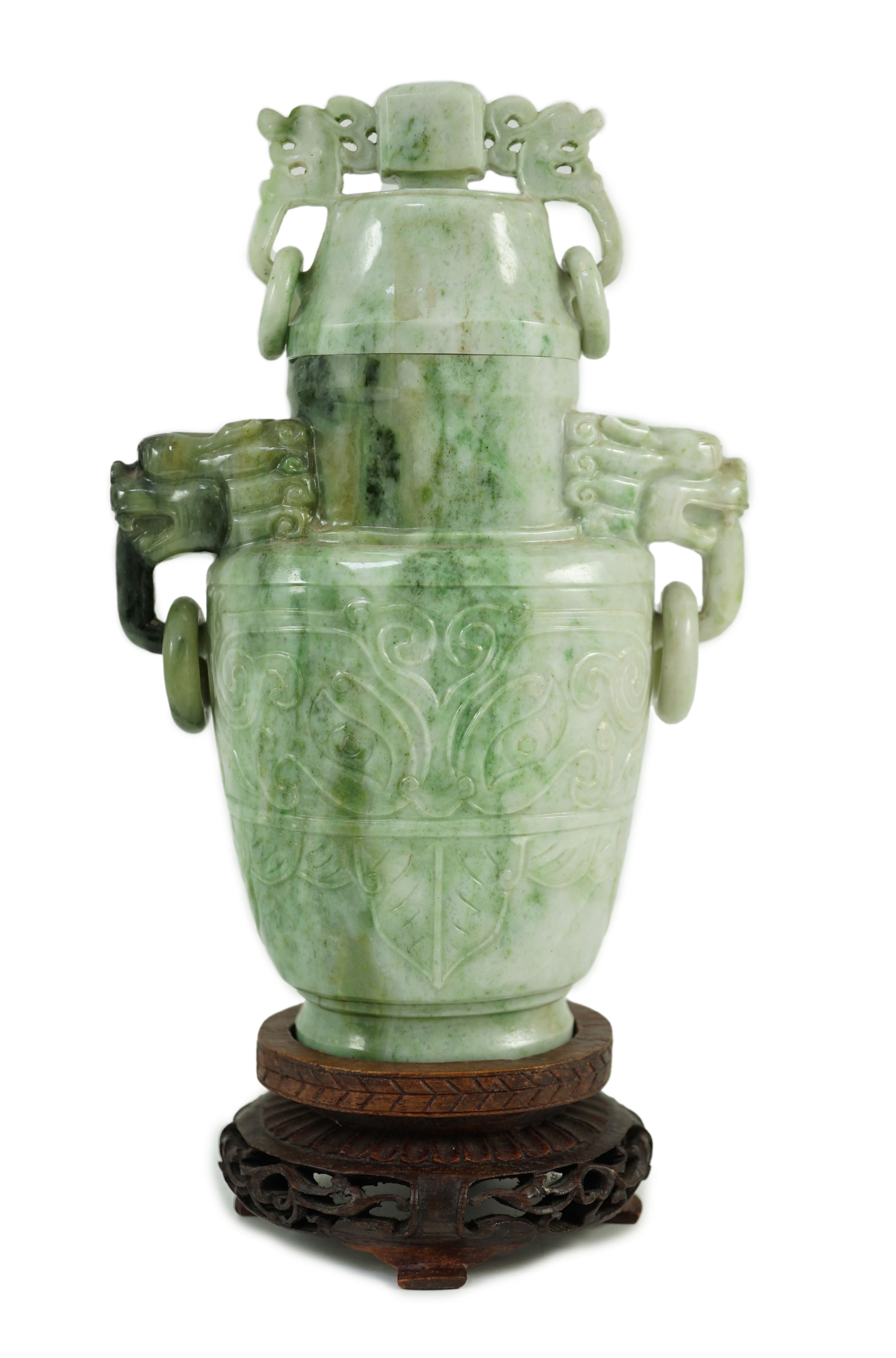 A Chinese archaistic jadeite two-handled vase and cover, first half 20th century, 16 cm high, excluding wood stand